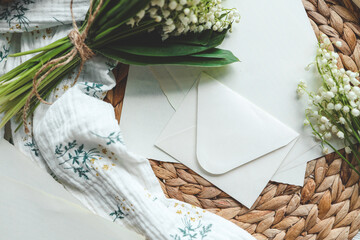 Envelope with lilies of the valley and aesthetic decor, holiday concept