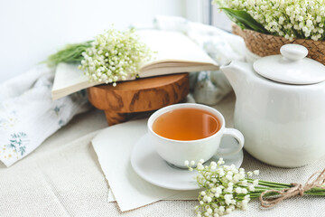 Cup of hot tea and spring home interior. good morning concept