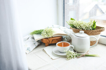 Cup of hot tea and spring home interior. good morning concept