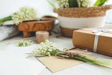 Bouquet of lilies of the valley close-up and greeting craft card