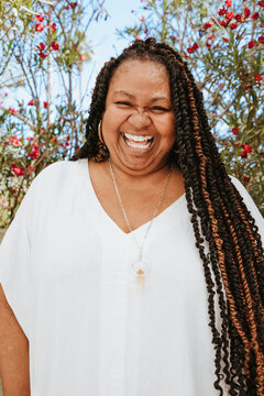 close up portrait of a plus size afro latinx haitian american woman smiling