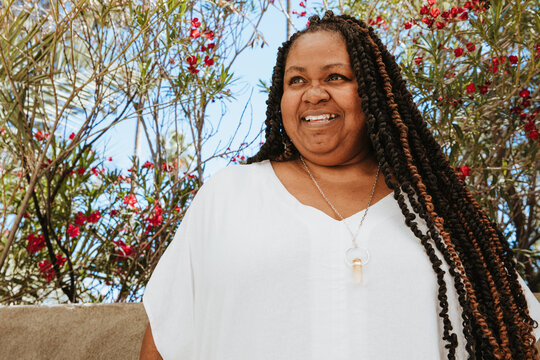 close up portrait of a plus size afro latinx haitian american woman smiling