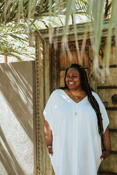 plus size afro latinx haitian american woman smiling outside
