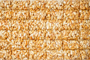 Tasty sunflower seeds kozinaki as background