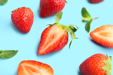 Fresh strawberries on blue background