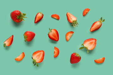 Slices of fresh strawberries on blue background