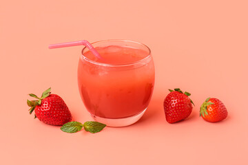 Glass with tasty strawberry smoothie on pink background