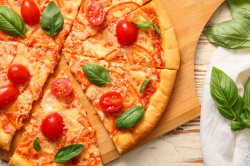 Board with tasty pizza margarita on white wooden background