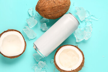 Composition with can of fresh soda, coconut and ice on blue background