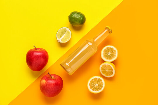 Composition with bottle of tasty soda, apples and lime on color background