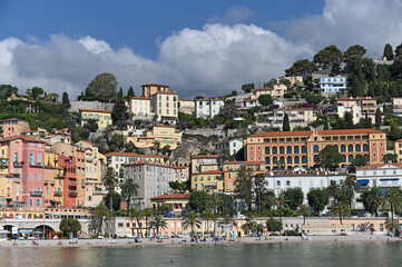 Beach and old buildings in Menton South France summer season