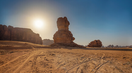 Rocky desert formations with sand in foreground, typical landscape of Al Ula, Saudi Arabia. Bright...