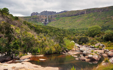 Fototapeta na wymiar Small river seen during trek to Pic Boby - Madagascar highest accessible peak in Andringitra national park, waterfalls visible in distance