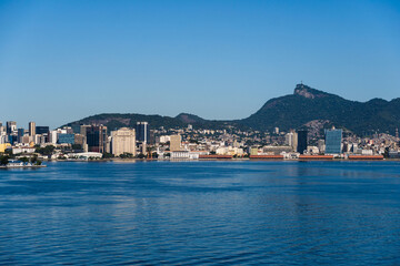 Beautiful view of Guanabara Bay in Rio de Janeiro, Brazil with the port, hills, Christ the Redeemer, Museum of Tomorrow and buildings in the background. Beautiful landscape and hill with the sea. 