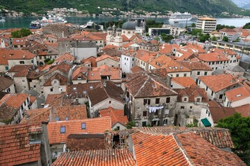 View of roofs of buildings of ancient Kotor from fortress wall. Kotor is a beautiful historic city on the Unesco list.