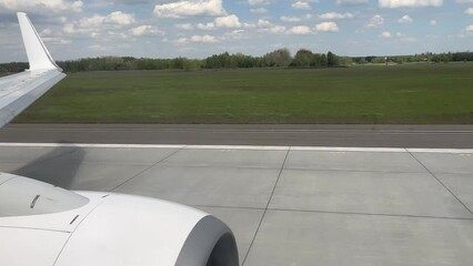 Take-off of the plane at the airport. View from the window of the aircraft.
