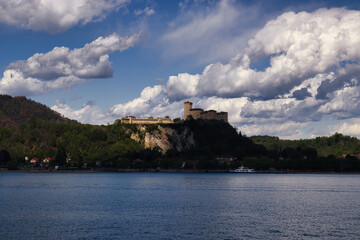 Fototapeta na wymiar the fortress of Angera seen from the shores of Lake Maggiore in Arona, Italy.