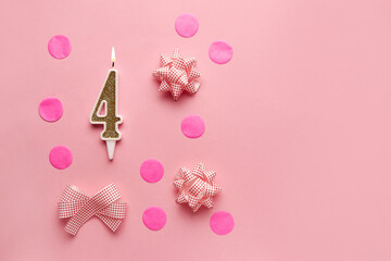Number 4 on pastel pink background with festive decor. Happy birthday candles. The concept of celebrating a birthday, anniversary, important date, holiday. Copy space. Banner