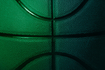 Closeup detail of blue and green basketball ball texture background. Horizontal sport theme poster,...