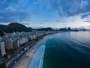 Rio de Janeiro City at Morning Twilight. Copacabana Beach and Atlantic Ocean. Blue Hour. Aerial...