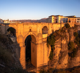 Beautiful exposure of the Ronda Bridge at sunset showing this magnificent work of engineering, always very popular among tourists due to its beauty and magnificent views.