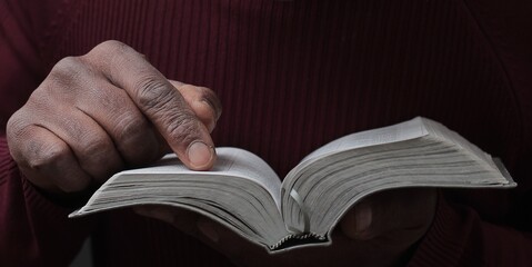 praying to God with hand on bible with people stock photo