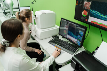 Examination of eyes of patient using optical coherence tomograph. Optical coherence tomography OCT...