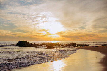 Sunset on the beach on the coast of Southern California in the Winter. - obrazy, fototapety, plakaty