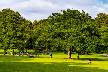 People hanging out on a summer day in the Slottsskogen park in Gothenburg, Sweden.