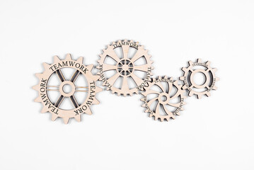 Gears. Wheels in interaction. Cooperation Team work. On a white background.