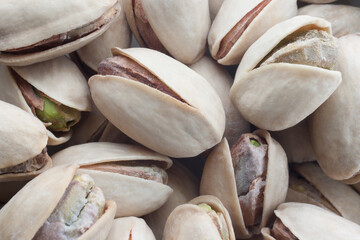 Pistachios salted nuts top view background