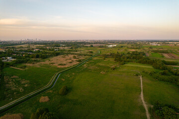 The surroundings of Pęcice and Pruszków, fish breeding ponds, a view of Pruszków and the center of Warsaw in the distance.