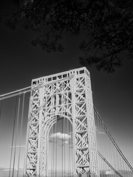 Vertical Black and white image of one of the support towers of the George Washington bridge spanning New Jersey and New York