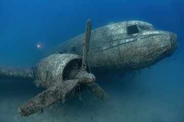 Wreck of an old passenger plane underwater.