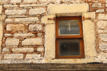 Fototapeta na wymiar Abstract close-up of Bodrum home wall with window.