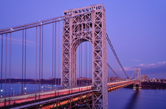 Dusk image of traffic flowing across the George Washington Bridge spanning between New Jersey and New York