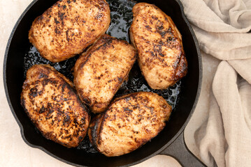 Pan Seared Oven Roasted Thick Pork Chops in a Cast Iron Pan - 605478533