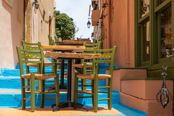 Outdoor tables and chairs on one of the Greek streets, Greece, Crete, Rethymno