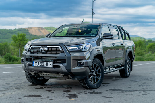 Cluj-Napoca, Cluj-Romania-05.22.2023-Ultimate Truck: Toyota Hilux Invincible 2021 - All Terrain 4WD Pick-Up - Detailed Photo in Empty Parking Lot