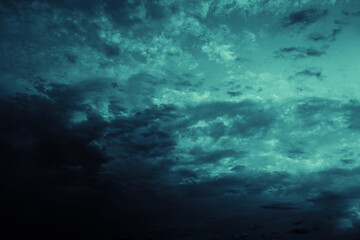 Black blue green teal night sky with clouds. Storm, wind, rain. Dramatic dark skies background....