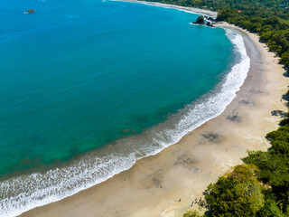 Aerial view of Manuel Antonio National Park in Costa Rica. The best Tourist Attraction and Nature Reserve with lots of Wildlife, Tropical Plants and paradisiacal Beaches on the Pacific Coast.