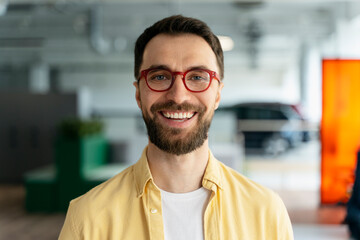 Fototapeta premium Confident businessman, sales manager in stylish spectacles, smiling looking confidently at camera