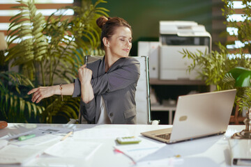 happy modern business woman at work stretching hands