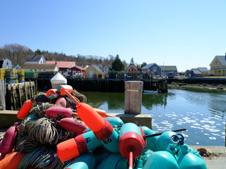 Colorful lobster floats sit on a dock on the Vinalhaven Island maine
