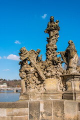 Fototapeta na wymiar Statuary of the Madonna and St. Bernard near the Old Town Bridge Tower. The sandstone statuary was created by Matěj Václav Jäckel in 1709. Prague,