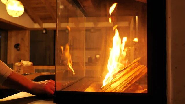 Fireplace on a cozy room background. slow motion.Warm cozy home atmosphere. 4k footage