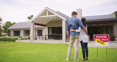 Sold, property and couple on lawn of new house for real estate, purchase and investment. Love, pride and future with man and woman hug on front yard of home for moving, mortgage and asset management