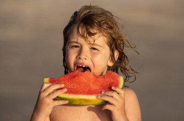 Portrait of summer kids. Kid with fruits and juice watermelon. Seasonal summer fruits. Kid holding slice of red watermelon on beach. Summer fun holiday. Kid enjoying summer fruit, sweet watermelon.