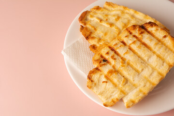 Toasted bread with melted butter, Brazilian breakfast food, Copy space