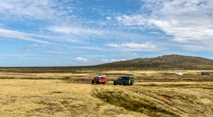 Naklejka premium Off-road vehicles transporting tourists to Volunteer Point in the Falkland Islands